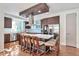 Gourmet kitchen featuring custom cabinets, stainless steel appliances, and an island with seating at 4514 W 34Th Ave, Denver, CO 80212