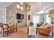 Inviting living room featuring a stone accent wall, fireplace, and stylish furnishings at 4514 W 34Th Ave, Denver, CO 80212