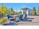 Inviting roof deck with comfortable seating, a fire pit, and great views of foliage and blue skies at 4514 W 34Th Ave, Denver, CO 80212