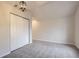 Bedroom featuring grey carpet, vaulted ceiling and large closet at 2043 Elmira St, Aurora, CO 80010