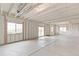Unfinished basement featuring large windows and exposed ceiling at 1904 Water Birch Way, Castle Rock, CO 80108