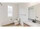 A bright bathroom featuring a granite vanity top, a walk-in shower, and modern fixtures at 1904 Water Birch Way, Castle Rock, CO 80108