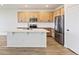 Well-lit kitchen featuring a spacious island, stainless steel appliances, and ample cabinet space at 1904 Water Birch Way, Castle Rock, CO 80108