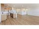 Open kitchen featuring a large island, stainless steel appliances, and hardwood floors at 1904 Water Birch Way, Castle Rock, CO 80108
