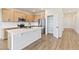 Bright kitchen featuring an island, stainless steel appliances, wood cabinets, and a pantry at 1904 Water Birch Way, Castle Rock, CO 80108