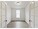 An office space featuring French doors, neutral paint, and a window to allow for ample natural light at 1904 Water Birch Way, Castle Rock, CO 80108