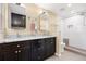 The primary bathroom features double sinks and tiled shower at 11035 E Berry Ave, Englewood, CO 80111