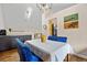 Charming dining area with a skylight, stylish decor, and an adjacent kitchen area at 11035 E Berry Ave, Englewood, CO 80111