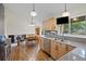 Open concept kitchen featuring stainless appliances, granite countertops, with adjacent dining area at 11035 E Berry Ave, Englewood, CO 80111