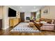 Cozy living room with hardwood floors, fireplace, and leather seating at 11035 E Berry Ave, Englewood, CO 80111