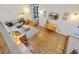 Bright living room featuring hardwood floors, modern decor, and ample natural light at 11035 E Berry Ave, Englewood, CO 80111