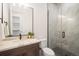 Modern bathroom with a large walk-in shower and marble vanity at 1571 Arrowpoint Ct, Franktown, CO 80116