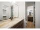 Elegant bathroom with marble vanity and walk-in shower at 1571 Arrowpoint Ct, Franktown, CO 80116