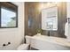 Stylish powder room with marble vanity and contemporary tile at 1571 Arrowpoint Ct, Franktown, CO 80116