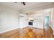 Open concept kitchen and living room with white appliances and hardwood floors at 1351 N Washington St # 23, Denver, CO 80203