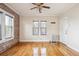 Bright living area with hardwood floors, radiator, and exposed brick wall at 1351 N Washington St # 23, Denver, CO 80203