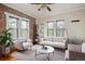 Inviting living room showcasing exposed brick, natural light, and stylish furniture at 1351 N Washington St # 23, Denver, CO 80203