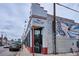 Retail building with Hudson Hill signage on a corner lot at 1351 N Washington St # 23, Denver, CO 80203