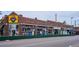 Brick retail building featuring street-facing windows and signage at 1351 N Washington St # 23, Denver, CO 80203