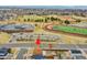 A house sits close to a school's athletic field, track, and parking, conveniently located near community resources at 14425 E 50Th Ave, Denver, CO 80239