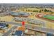 A home sits adjacent to a community school with sport facilities, parking, and easy street access at 14425 E 50Th Ave, Denver, CO 80239