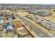 A home next to a neighborhood school featuring a playing field, school building, and ample parking at 14425 E 50Th Ave, Denver, CO 80239