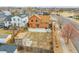 Aerial view of the backyard with a red fence, small shed, patio area, and a garden for outdoor enjoyment at 14425 E 50Th Ave, Denver, CO 80239