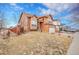 Beautiful two-story home with well-maintained landscaping, a two-car garage, and a cozy front entrance at 14425 E 50Th Ave, Denver, CO 80239