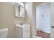 Bright bathroom featuring a modern vanity and view into an adjacent room at 9955 Fillmore St, Thornton, CO 80229