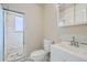 Bathroom showcasing a glass shower, toilet, and single vanity sink at 9955 Fillmore St, Thornton, CO 80229