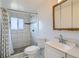 Updated bathroom featuring tile shower and modern vanity at 9955 Fillmore St, Thornton, CO 80229