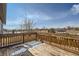 Spacious wooden deck offers an inviting space for outdoor entertaining and relaxation at 9955 Fillmore St, Thornton, CO 80229