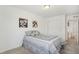 Comfortable bedroom featuring neutral carpet, closet, and modern decor at 27593 E 1St Pl, Aurora, CO 80018