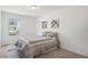 Cozy bedroom with neutral carpet, natural light, and floral themed decor at 27593 E 1St Pl, Aurora, CO 80018