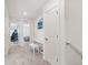 Upstairs hallway featuring a built-in desk area and access to bedrooms at 27593 E 1St Pl, Aurora, CO 80018