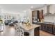 Modern kitchen with granite countertops, stainless steel appliances, and a view to the living room at 27593 E 1St Pl, Aurora, CO 80018