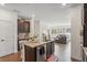 Open-concept kitchen and living room layout with recessed lighting and hardwood floors at 27593 E 1St Pl, Aurora, CO 80018