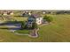 Picturesque aerial view of a home nestled within a large lot and surrounded by lush greenery at 881 Kirby Ct, Watkins, CO 80137