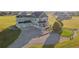 Expansive property featuring a well-kept home with a three-car garage and a manicured front yard at 881 Kirby Ct, Watkins, CO 80137