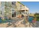 Backyard patio with outdoor seating and upper deck, ideal for entertaining at 881 Kirby Ct, Watkins, CO 80137