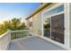 Outdoor deck with white railings and sliding glass doors at 881 Kirby Ct, Watkins, CO 80137