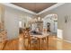 Cozy dining room with an archway entrance and views into the living area at 881 Kirby Ct, Watkins, CO 80137