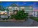 Landscaped backyard featuring a patio, garden area, and a well-maintained two-story home at 881 Kirby Ct, Watkins, CO 80137