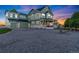 Charming two-story home with three-car garage, landscaped yard and a welcoming front porch at 881 Kirby Ct, Watkins, CO 80137