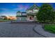 Beautiful two-story home boasts lush landscaping, a large front yard, and a welcoming porch at 881 Kirby Ct, Watkins, CO 80137