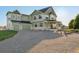 Charming two-story home with a well-manicured lawn, spacious driveway and a covered porch at 881 Kirby Ct, Watkins, CO 80137