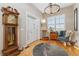Inviting foyer featuring a grandfather clock, stylish decor, and a welcoming atmosphere at 881 Kirby Ct, Watkins, CO 80137