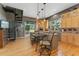 Eat-in kitchen features modern appliances, plenty of natural light, and a spiral staircase at 881 Kirby Ct, Watkins, CO 80137