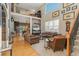 Spacious living room with high ceilings, large windows, and comfortable seating at 881 Kirby Ct, Watkins, CO 80137