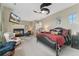 Relaxing main bedroom with fireplace, TV, and lounge chair at 881 Kirby Ct, Watkins, CO 80137